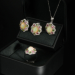 A luxurious 925 silver women's jewelry set with cabochon opal, green peridot, and pink tourmaline halo stones.