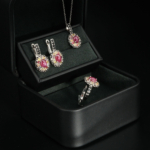 A luxurious 925 silver women's jewelry set with cabochon ruby, colorful sapphire, and black onyx halo gemstones.