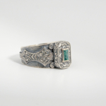 A 925 sterling silver handmade unisex ring featuring a natural baguette cut Zambian emerald gemstone.