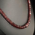 A high grade 7A+ natural faceted rondelle cut red garnet gemstone necklace with 925 sterling silver clasp.