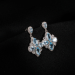 A pair of original marquise cut blue topaz natural stone 925 sterling silver flower design dangle drop earrings with zircon accents.