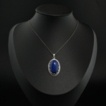 925 sterling silver women necklace featuring an oval natural blue lapis lazuli gemstone with enamel and zircon halo.