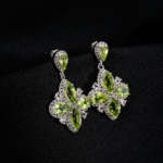A pair of original marquise cut peridot natural stone 925 sterling silver flower design dangle drop earrings with zircon accents.