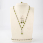 A 925 sterling silver women's jewelry set featuring natural green peridot gemstones with a 45+5cm necklace and 16+3cm bracelet.