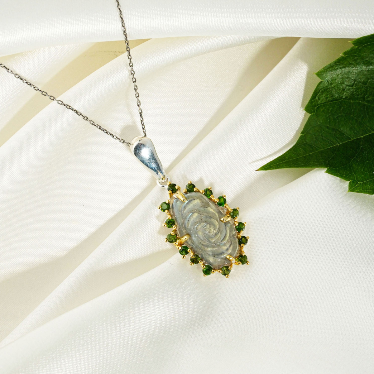 A 925 sterling silver women's pendant featuring a hand-carved labradorite rose gemstone surrounded by green chrome diopside halo.