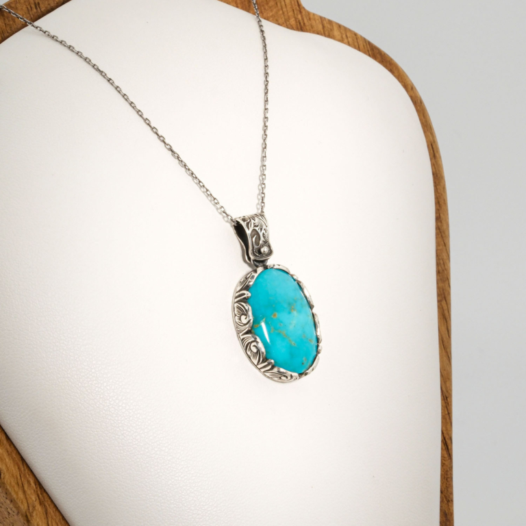 A 925 sterling silver handmade unisex pendant featuring a natural oval Arizona blue turquoise gemstone.