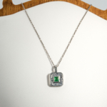A 925 sterling silver handmade unisex pendant featuring a natural square cut Zambian emerald gemstone.