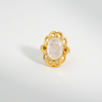 A 925 sterling silver gold-plated women's ring featuring a 6.5 ct natural oval cabochon blue sheen moonstone gemstone with lace bezel.