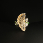 A 925 sterling silver women's ring featuring a hand-carved citrine leaf gemstone accented with green chrome diopside stones.