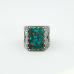 Bague pour homme faite main en argent 925 sertie d'une turquoise naturelle taillée en rectangle.