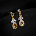 A pair of original citrine natural stone 925 sterling silver drop dangle earrings with zircon halo accents.