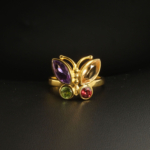 A gold-plated 925 sterling silver women's ring featuring a butterfly design with marquise and round faceted amethyst, citrine, peridot, and garnet gemstones.